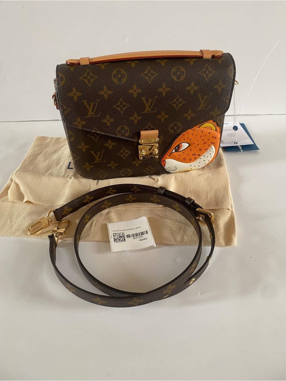 Louis Vuitton pochette Metis (tiger face)